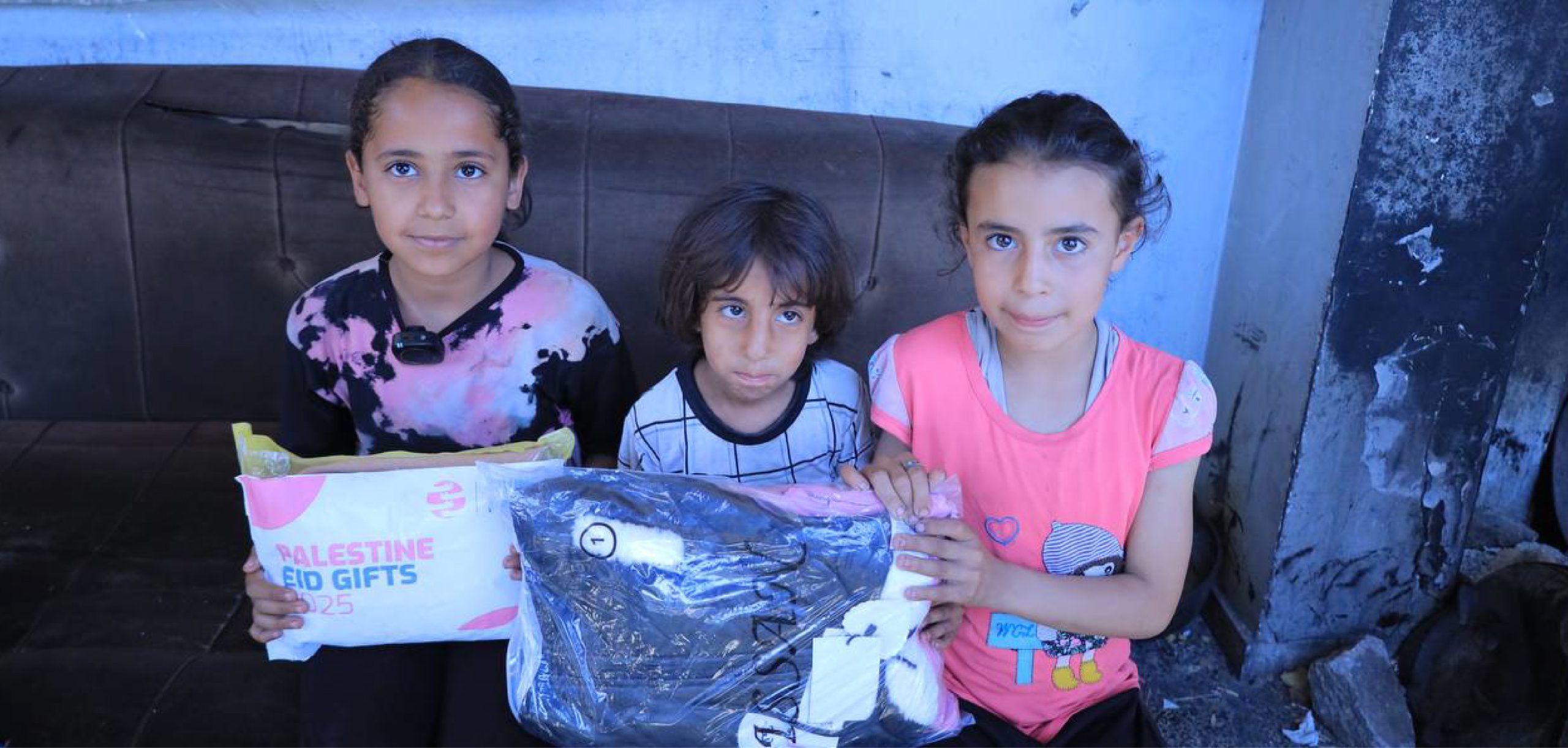Children in Palestine receiving Eid gifts from Giving Hands Canada Islamic charity