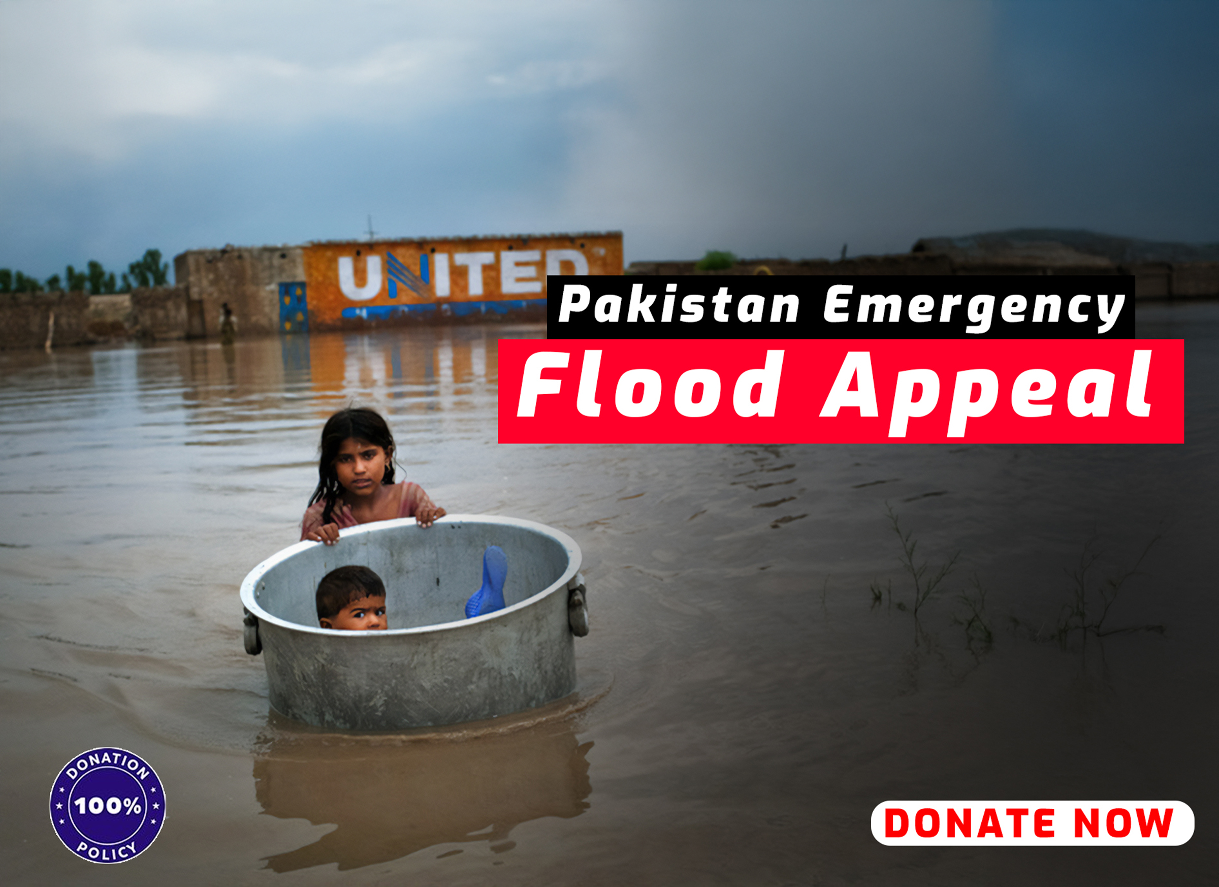 Children in a metal tub in floodwater with Pakistan Flood Appeal banner.