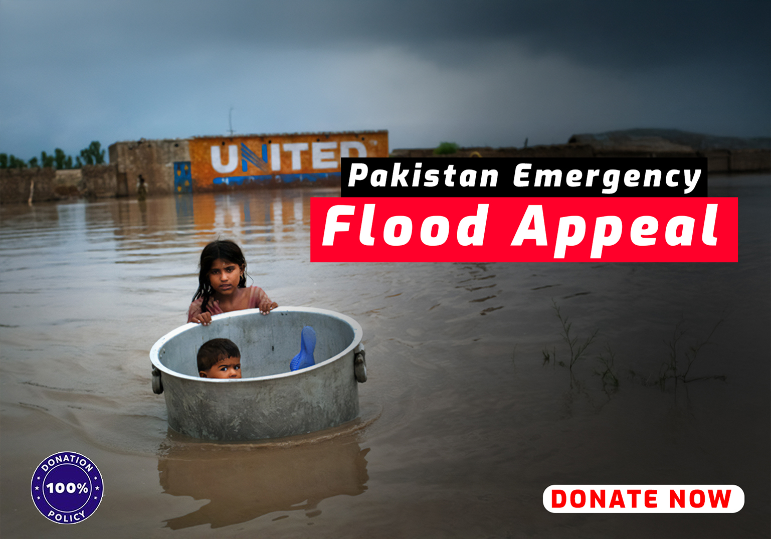 Children in a metal tub in floodwater with Pakistan Flood Appeal banner.
