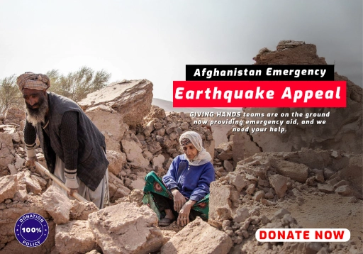 Two people among earthquake rubble with Afghanistan Emergency Earthquake Appeal banner.